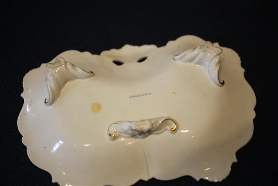 A Japanese dragon bowl, two Davenport flower painted dessert dishes and an English porcelain lozenge shaped bread bowl,